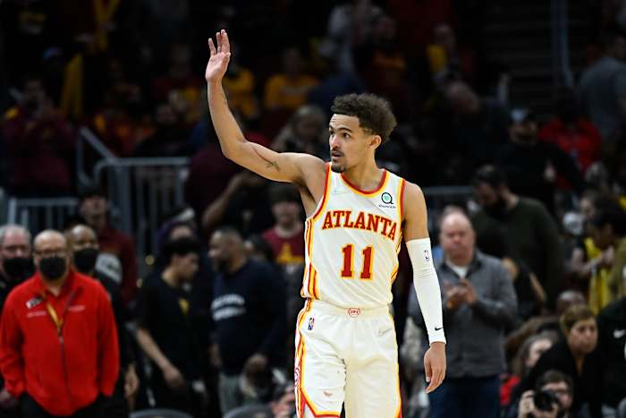 Trae Young waves to Cleveland fans after a win.